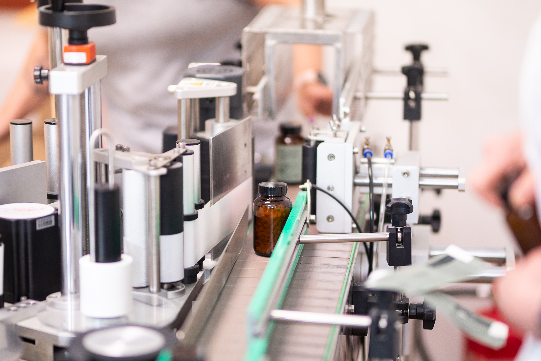 Amber supplement bottle on the Involutus packaging and labelling line